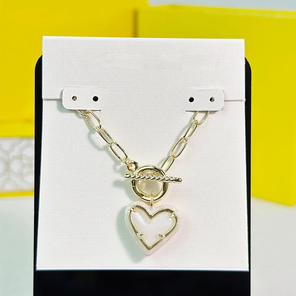 Ari Heart Necklace & Earrings Set – Gold Enamel Frame with Ivory Mother-of-Pearl- Kendra Scott